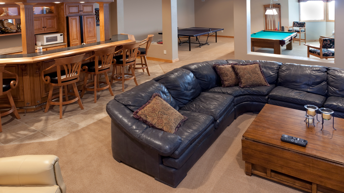 A living room filled with furniture and a pool table